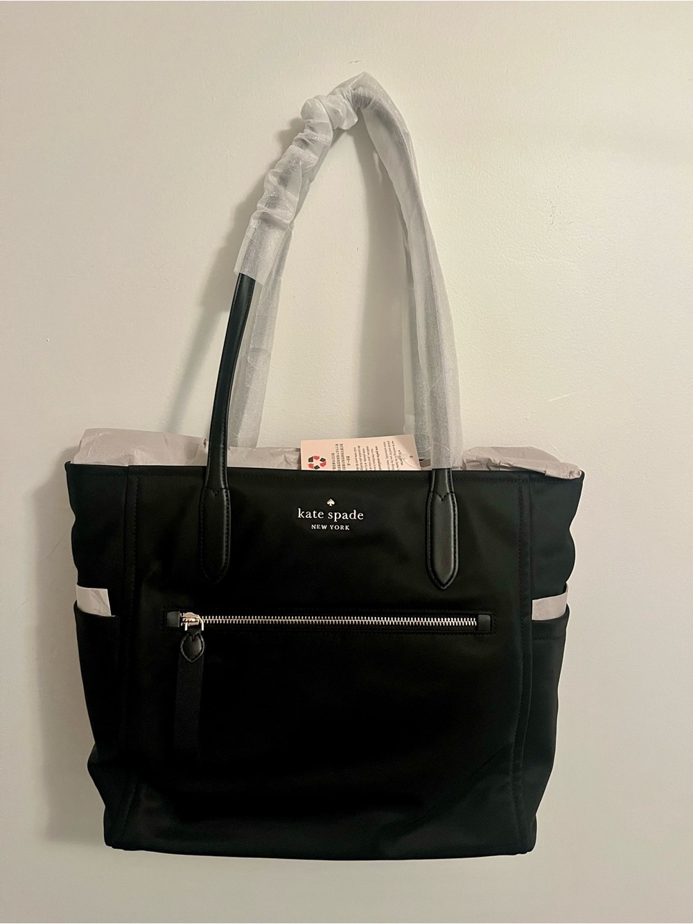 kate spade large black chelsea tote with front zip pocket and top handles